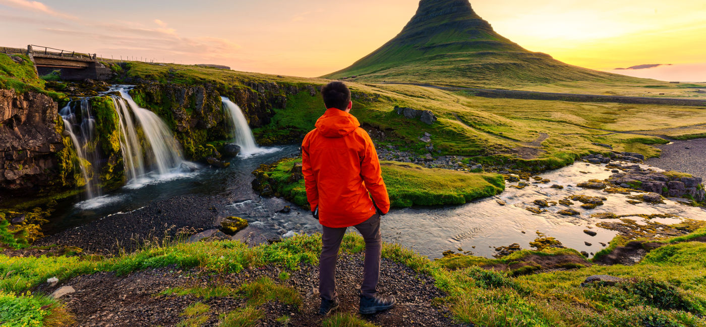 Image: Traveler taking in the sunrise in Iceland. (Photo Credit: iStock / Getty Images Plus)