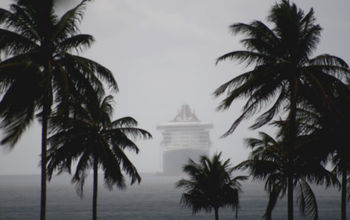Cruise ship in misty rainy seas.
