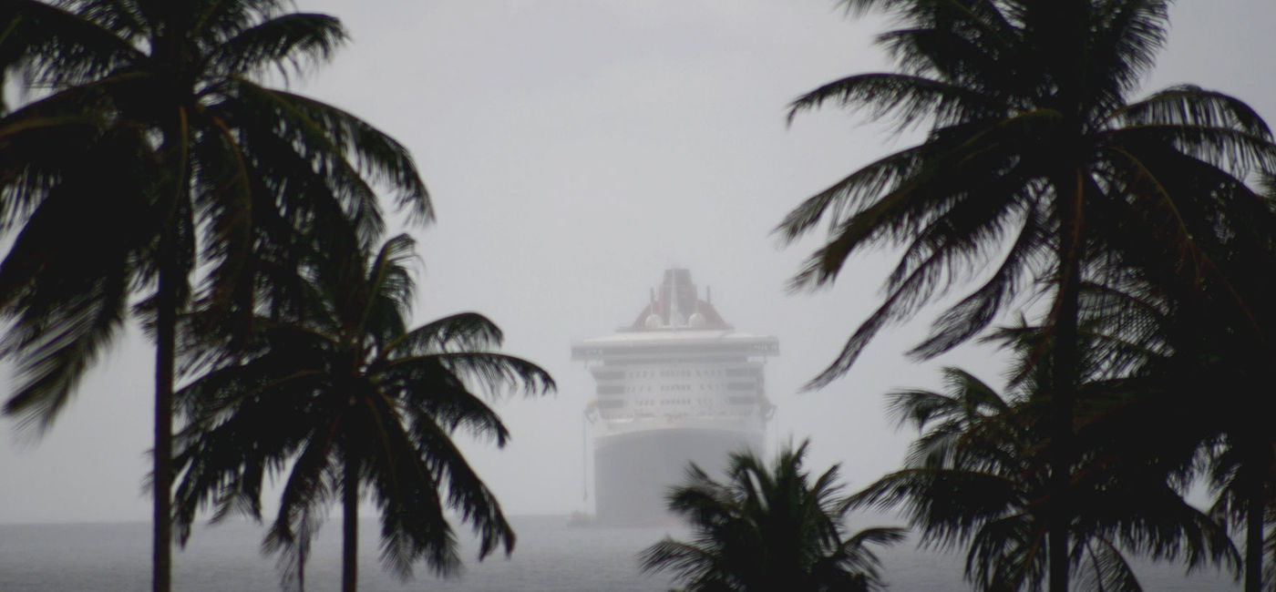 Image: Cruise ship in misty rainy seas. (photo via jaminwell / iStock / Getty Images Plus)
