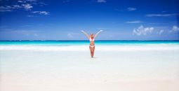 Happy woman on the beach in Cancun, Mexico