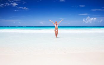 Happy woman on the beach in Cancun, Mexico