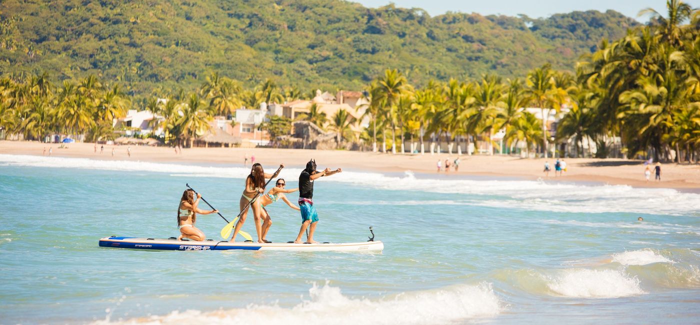 Image: Paddleboarding in the ocean. (photo via Riviera Nayarit)