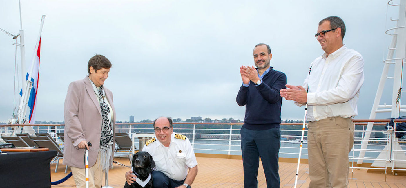 Image: Holland America Line President Gus Antorcha and Rotterdam’s Captain Werner Timmers with Joska her owners Cornelia “Connie” and Cornelis Marinussen. (Holland America Line)