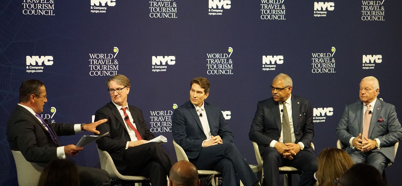 Image: Moderator Richard Quest (left) discusses Cuba with Charles Himmelberg of Goldman Sachs, Philip Lovas of the U.S. State Department, Arnold Donald of Carnival Corp. and Roger Dow of the U.S. Travel Association. (Photo by Brian Major).