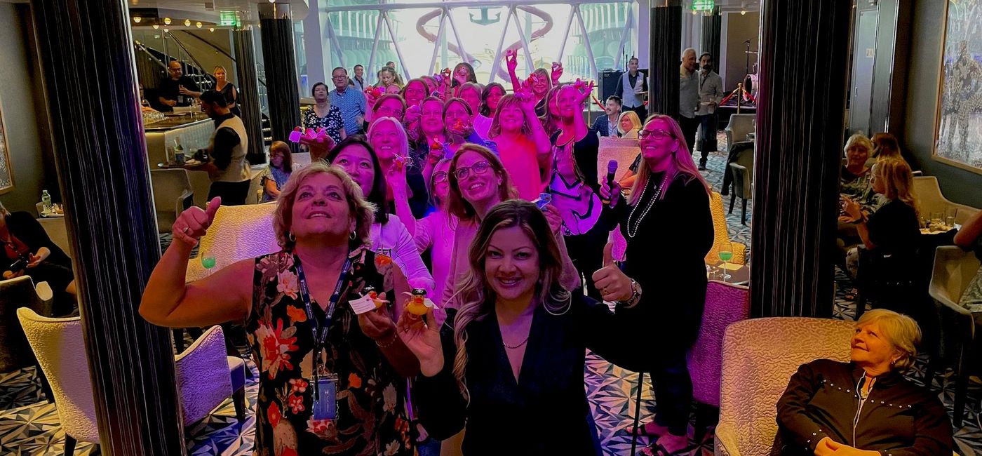 Image: ACV Seminar at Sea participants search for hidden ducks -- and potential prizes -- at the opening VIP cocktail event on Symphony of the Seas. (Bruce Parkinson)