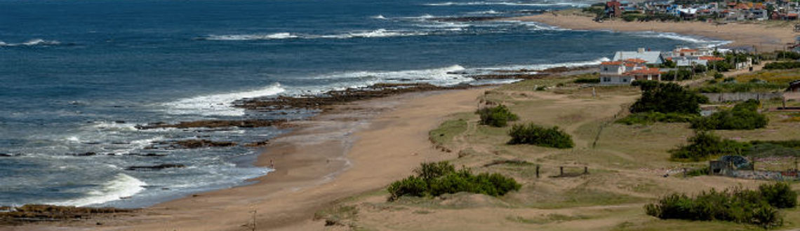 The beaches of Uruguay invite visitors to rest and enjoy them with their families. (Photo via MarcosMartinezSanchez/iStock/Getty Images Plus).