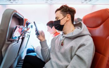 One passenger with a mask, and one without
