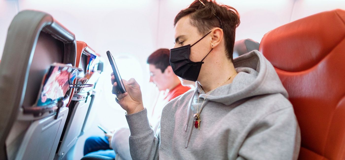 Image: One passenger with a mask, and one without. (photo via getty images / SolStock) (getty images /  SolStoc)