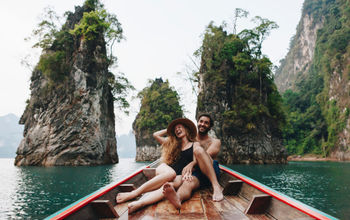 Couple relaxing on a boat in Thailand