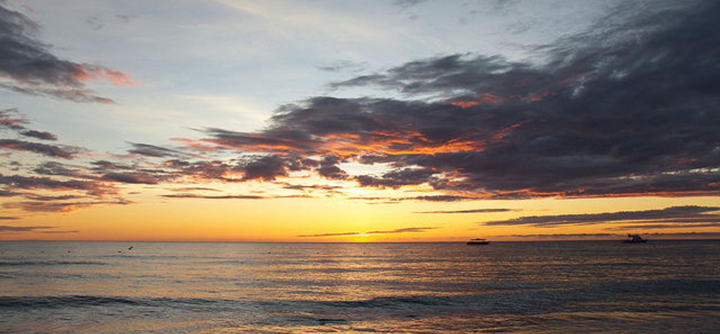 Image: PHOTO: Sunset at Couples Resort in Negril, Jamaica (Photo via Flickr/Ben Sanborn)