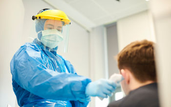 Medical worker wearing personal protective equipment.