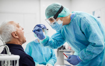 Doctor testing patient for COVID-19.