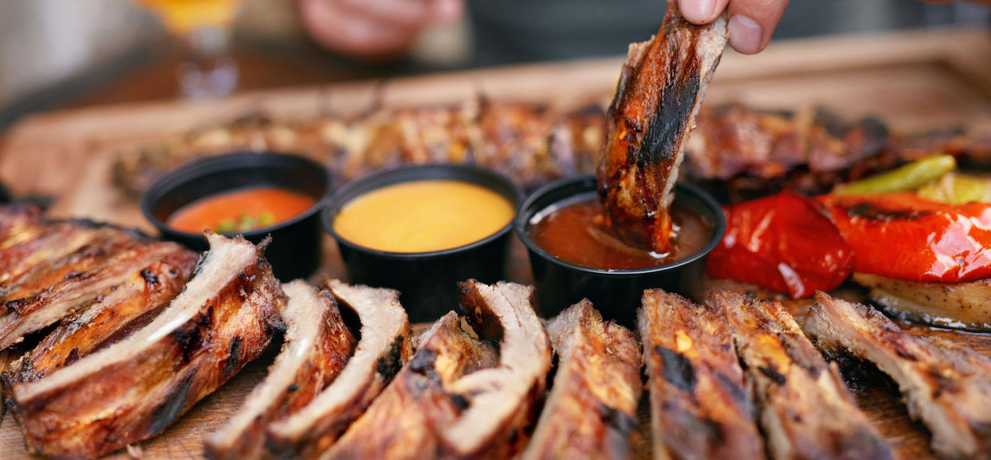 Image: Rack of BBQ Ribs and Dipping Sauces. (Photo Courtesy of iStock / Getty Images Plus / puhhha)