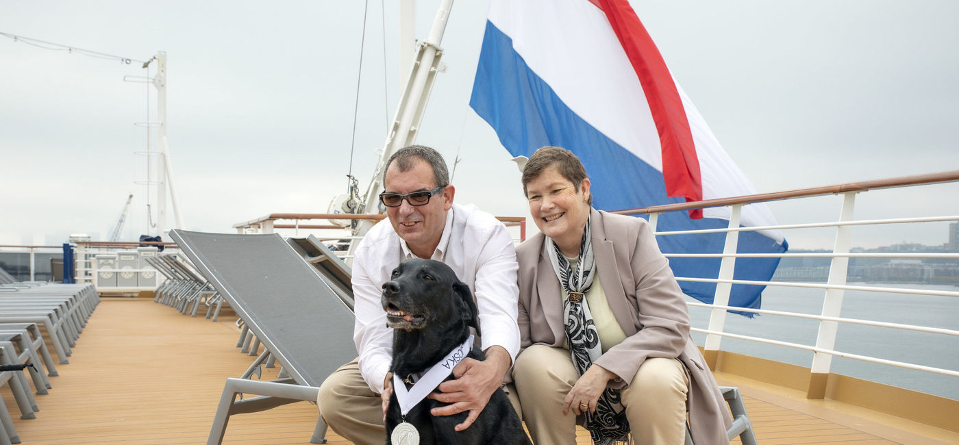 Image: Joska poses with Cornelis and Cornelia Marinussen as she's awarded her Platinum Medallion aboard the Rotterdam. (photo via Holland America Line) ((photo via Holland America Line))