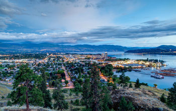 Aerial View of Kelowna, British Columbia, just after sunset on Knox Mountain, Canada. (Photo via ronniechua / iStock / Getty Images Plus)