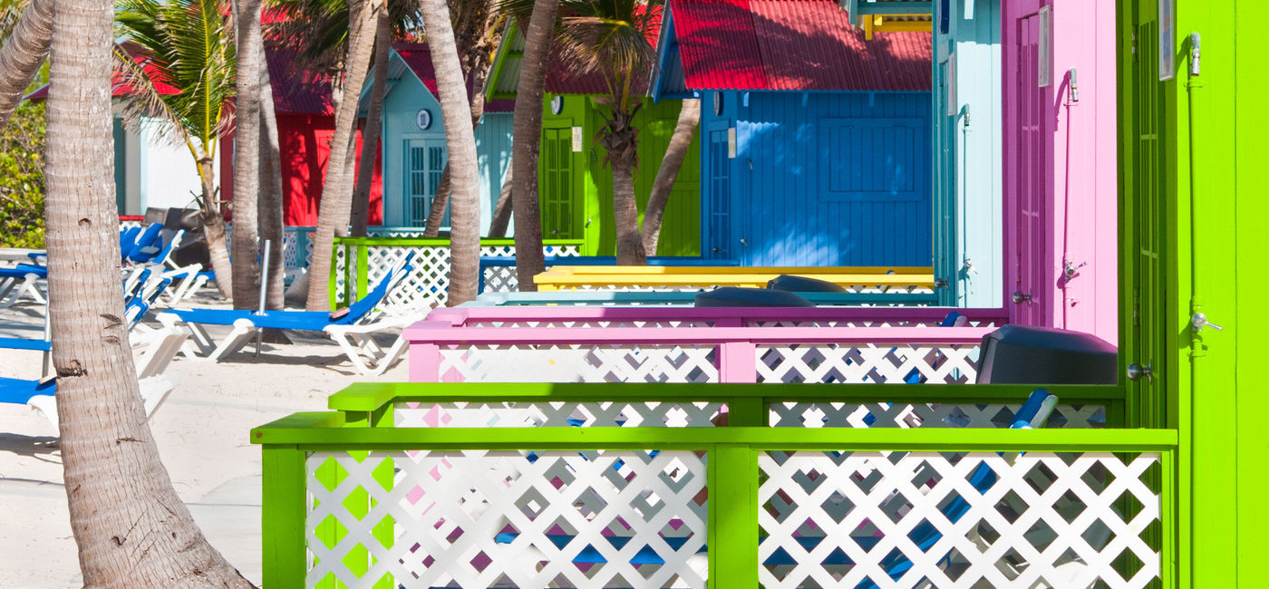 Image: Beach bungalows on Princess Cays in the Bahamas (photo via vale_t / iStock / Getty Images Plus)
