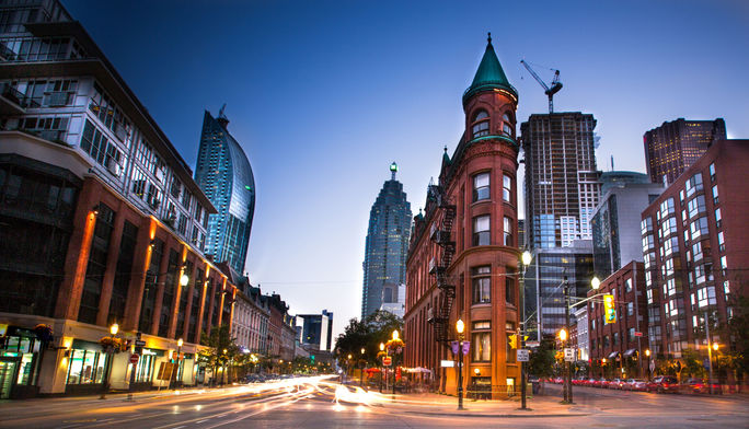Downtown Toronto, Ontario Downtown Toronto, Ontario facing West along Front street. Long exposure at dusk. (Steven_Kriemadis / iStock / Getty Images Plus)