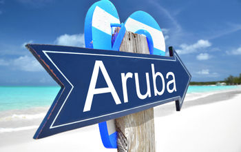 Aruba sign on the beach (Photo via Pincasso / iStock / Getty Images Plus)