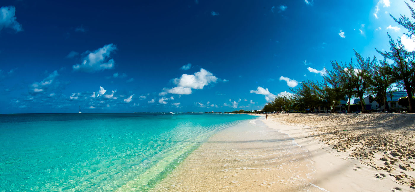 Image: PHOTO: The beach on Grand Cayman Island. (Photo via  WGCPhotography / iStock / Getty Images Plus)