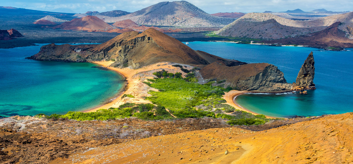 Image: View of two beaches on Bartolome Island in the Galapagos Islands in Ecuador. (photo via DC_Columbia/iStock/Getty Images Plus)