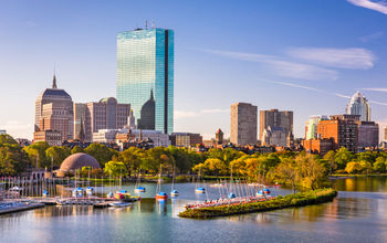 Boston, Massachusetts, USA city skyline on the river. (Photo via  Sean Pavone / iStock / Getty Images Plus)