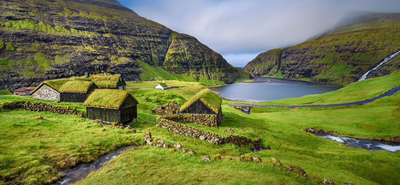 Image: Village of Saksun located on the island of Streymoy, Faroe Islands, Denmark. Long exposure. (photo via miroslav_1 / iStock / Getty Images Plus)