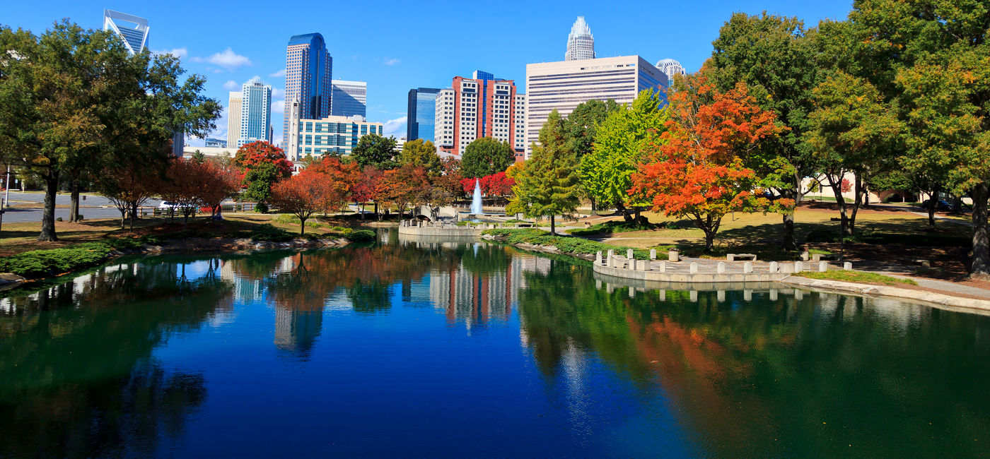 Image: Charlotte skyline from Marshall Park in the fall. The new Skye condos are in the middle. (Photo via  JillLang / iStock / Getty Images Plus)