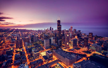 Chicago skyline aerial view at dusk, United States (Photo via  marchello74 / iStock / Getty Images Plus)