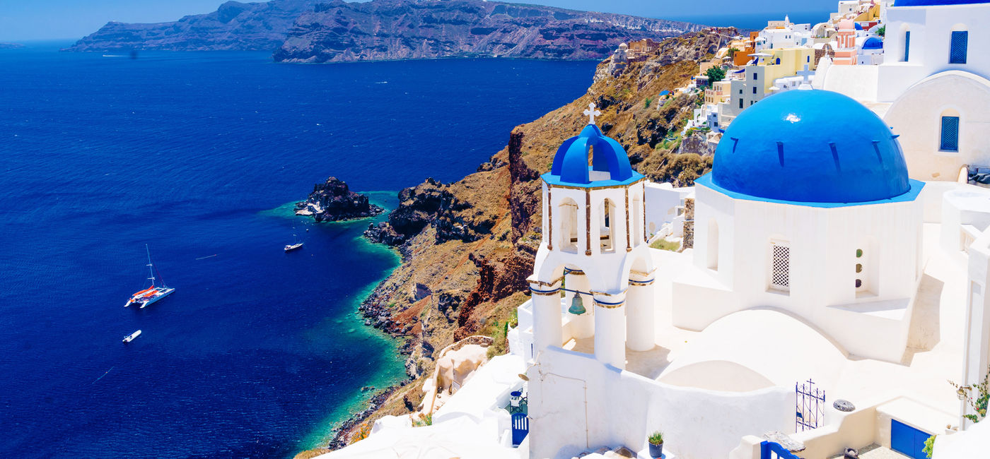 Image: Take in the stunning  architecture and churches in Santorini, Greece with Classic Escapes. (photo via Aetherial/iStock/Getty Images Plus)