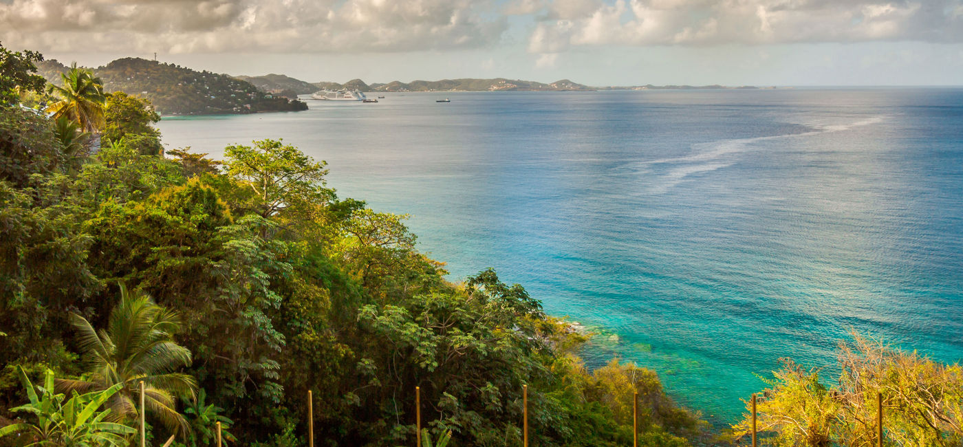 Image: Sea Lagoo view in Grenada Capital City, St. George (photo via Paulo Costa/iStock/Getty Images Plus)