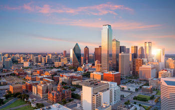 Dallas, Texas cityscape with blue sky at sunset in USA (photo via f11photo/iStock / Getty Images Plus)