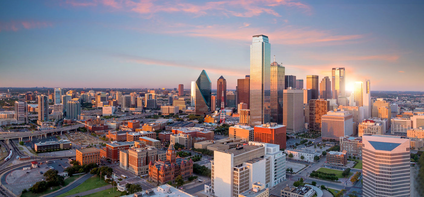Image: Dallas, Texas cityscape with blue sky at sunset. (photo via f11photo/iStock / Getty Images Plus)
