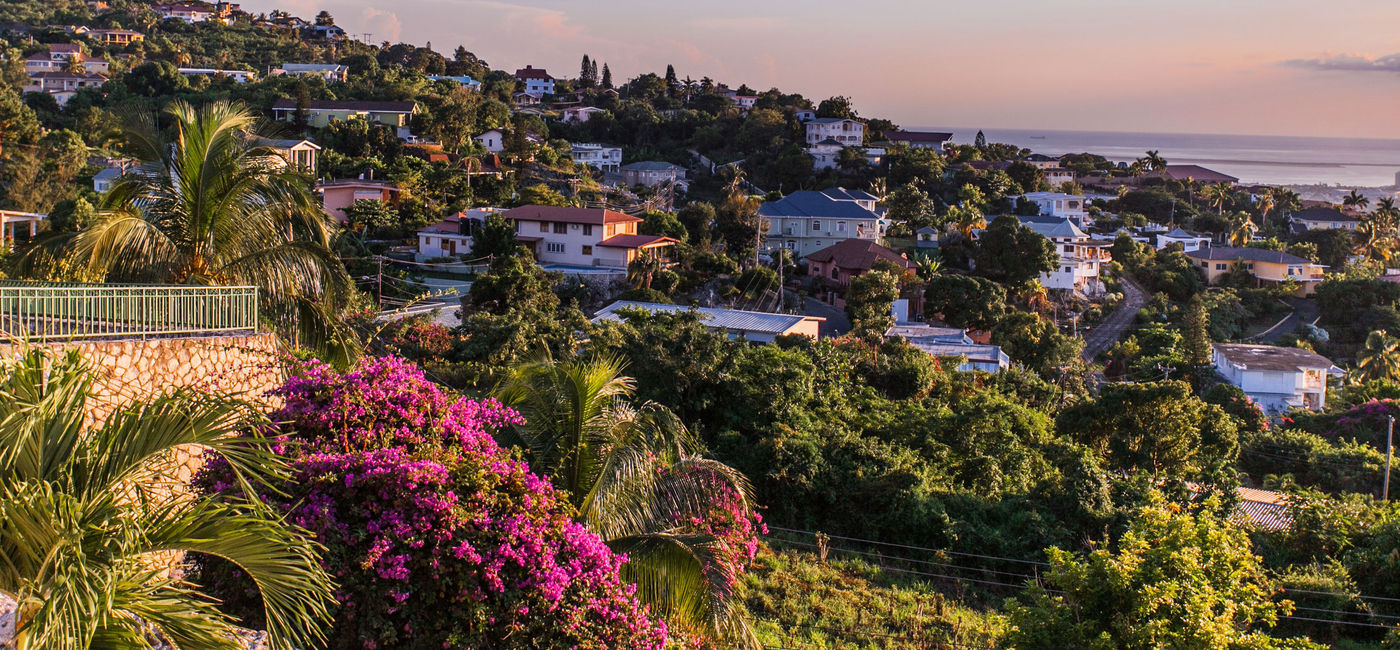 Image: Kingston in Jamaica at sunset. (photo via GummyBone / iStock / Getty Images Plus)