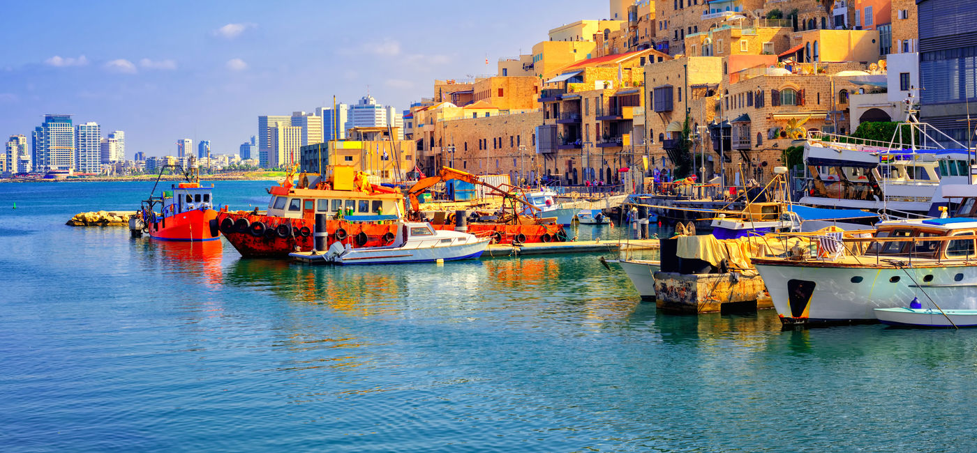 Image: Old town and port of Jaffa and modern skyline of Tel Aviv, Israel. (photo via Xantana / iStock / Getty Images Plus)
