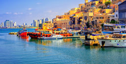 Old town and port of Jaffa and modern skyline of Tel Aviv city, Israel (photo via Xantana / iStock / Getty Images Plus)
