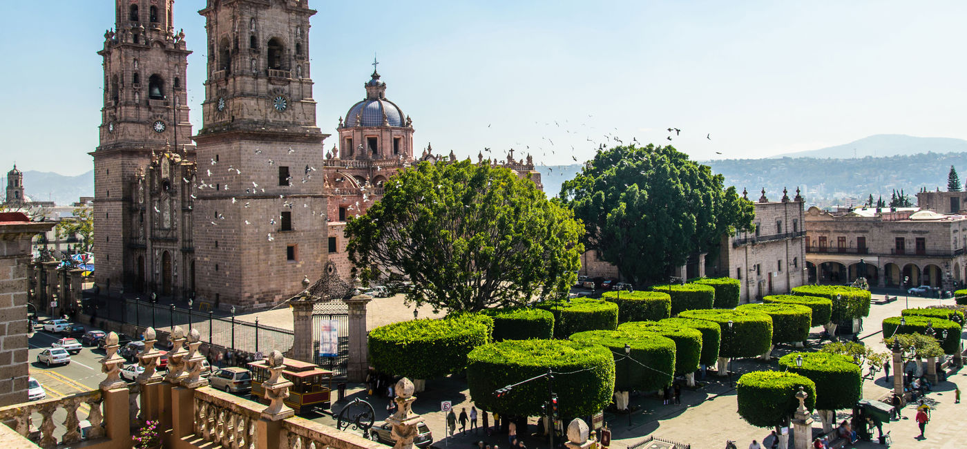 Image: High point of view of Morelia Cathedral and town square. (photo via Esdelval / iStock / Getty Images Plus)
