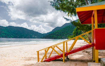 Maracas beach trinidad and tobago lifeguard cabin side view empty beach (photo via Altinosmanaj / iStock / Getty Images Plus)