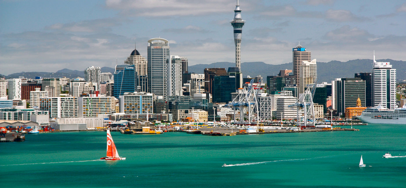 Image: Sunny clear Skyline of Auckland, New Zealand (photo via stefaniedesign / iStock / Getty Images Plus)