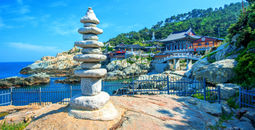 Haedong Yonggungsa Temple and Haeundae Sea in Busan, Korea (Photo via tawatchaiprakobkit / iStock / Getty Images Plus)