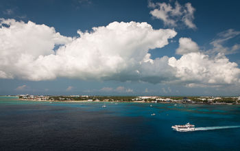 Aerial view of a coastline of Grand Cayman, Cayman Islands (photo via unclegene/iStock/Getty Images Plus)