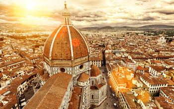 Florence sunny view, Italy. The Basilica di Santa Maria del Fiore (Basilica of Saint Mary of the Flower) in the foreground. (photo via scaliger / iStock / Getty Images Plus)