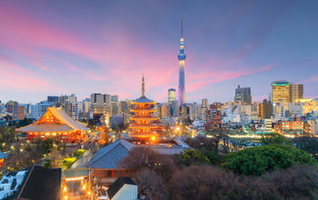 View of Tokyo skyline at sunset in Japan. (photo via f11photo / iStock / Getty Images Plus)