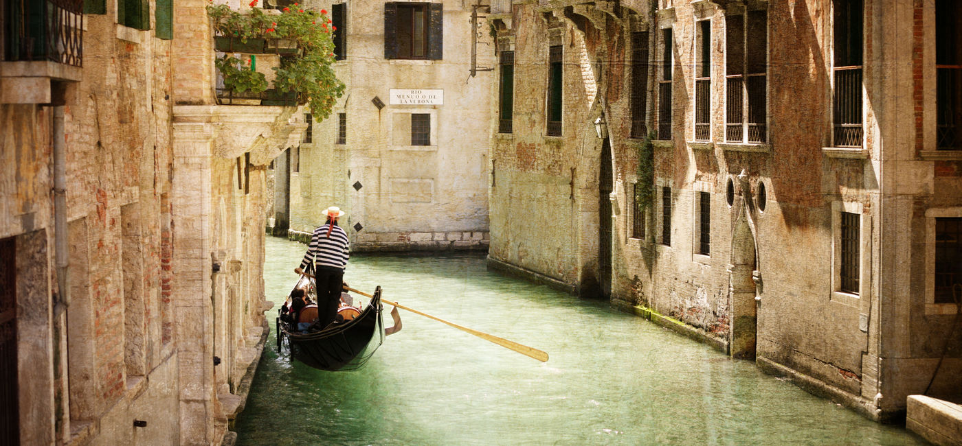 Image: Gondola travels down the canals of Venice in Italy. (Photo via BrianAJackson / iStock / Getty Images Plus)