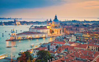 Aerial view of the Venice with Basilica di Santa Maria della Salute taken from St. Mark's Campanile. (photo via RudyBalasko / iStock / Getty Images Plus)