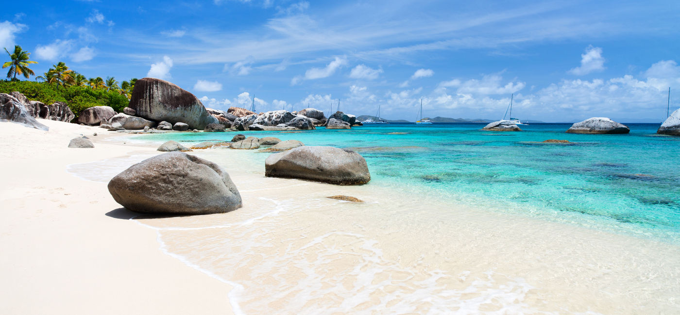 Image: Beautiful tropical beach with white sand, turquoise ocean water and blue sky at Virgin Gorda, British Virgin Islands in Caribbean (Photo via shalamov / iStock / Getty Images Plus)
