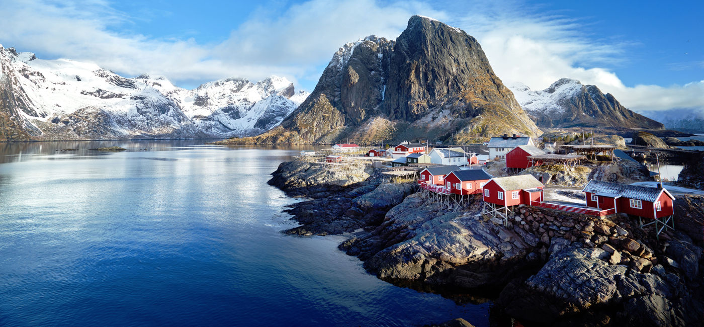 Image: Fishing huts on a spring day in Reine, Lofoten islands, Norway. (IakovKalinin / iStock / Getty Images Plus)