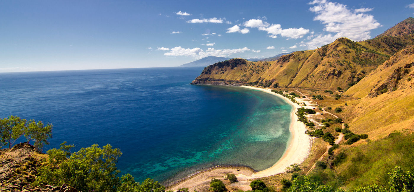 Image: The view from Cristo Rei Statue in Dili, East Timor (photo via gaborbasch / iStock / Getty Images Plus)