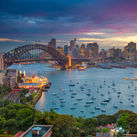 Cityscape image of Sydney, Australia with Harbour Bridge and Sydney skyline during sunset. (photo via RudyBalasko / iStock / Getty Images Plus)