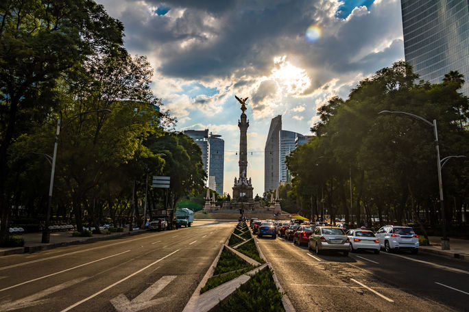 Paseo de La Reforma avenue and Angel of Independence Monument - Mexico City, Mexico (photo via diegograndi / iStock / Getty Images Plus)