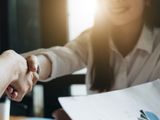 women-handshake-stock-AdobeStock_213784279